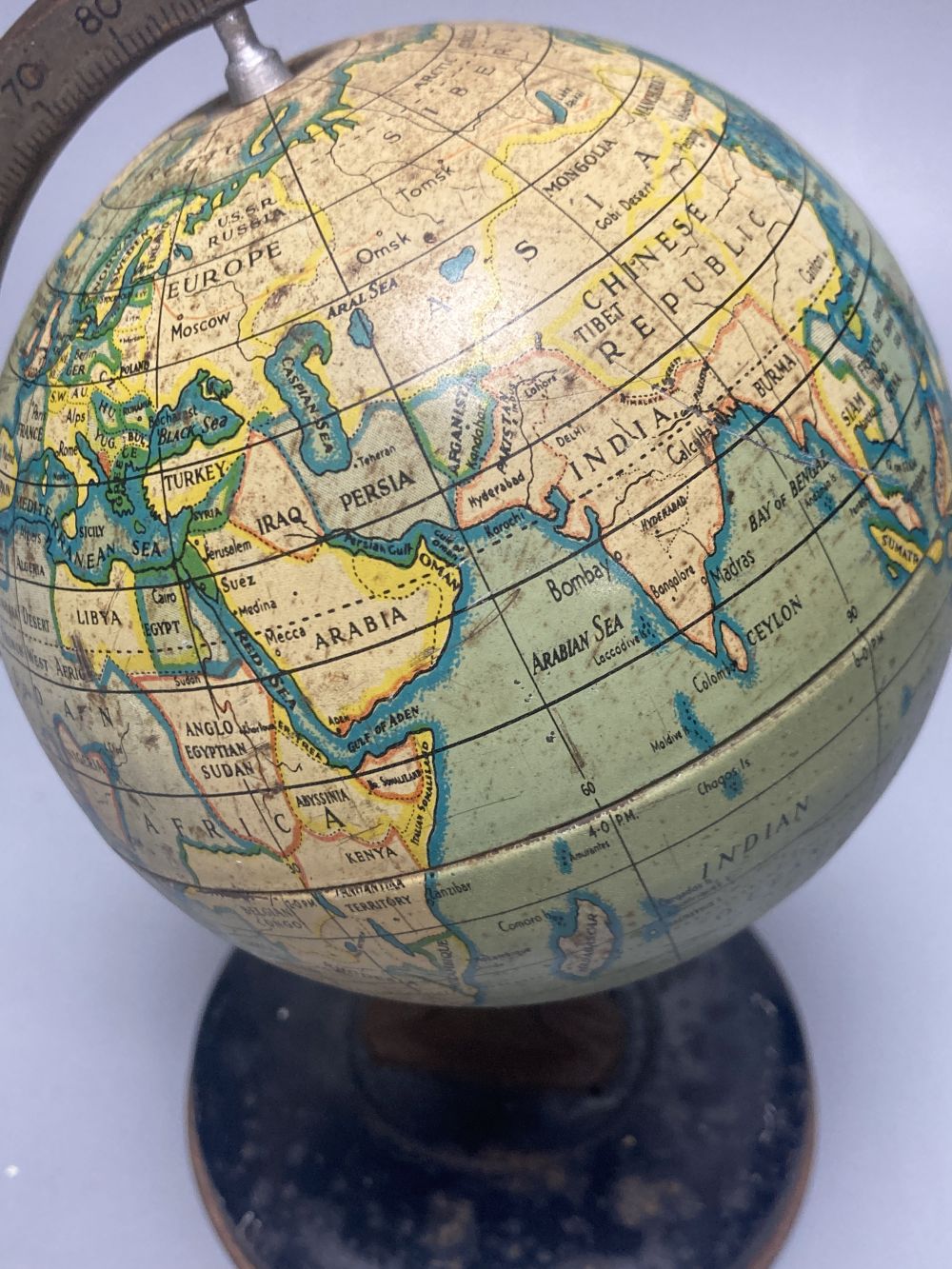 A Reliable Series lithographed tinplate revolving globe, 20cm, and two graphic globes,on ebonised wood bases, one by Philips